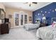 A charming bedroom with two twin beds and french doors, offering ample natural light and a cozy feel at 4040 Annecy Dr, Atlanta, GA 30331