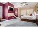 A cozy bedroom with a striped accent wall and a comfortable-looking bed at 4040 Annecy Dr, Atlanta, GA 30331