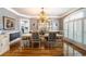 Elegant dining room with chandelier lighting, large window, and stylish decor at 4040 Annecy Dr, Atlanta, GA 30331