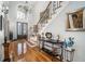 Welcoming foyer featuring gleaming hardwood floors, a grand staircase, and elegant decor at 4040 Annecy Dr, Atlanta, GA 30331