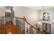 Staircase overlooking the two-story foyer with a chandelier and double doors at 4040 Annecy Dr, Atlanta, GA 30331