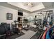 A home gym with a treadmill, stationary bike, mirrored wall, and weight machines at 4040 Annecy Dr, Atlanta, GA 30331