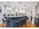 Open kitchen boasts a large granite island with barstool seating and stainless steel appliances at 4040 Annecy Dr, Atlanta, GA 30331