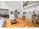 Open-concept living area with hardwood floors, balcony and comfortable seating arrangements at 4040 Annecy Dr, Atlanta, GA 30331