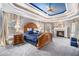 Spacious main bedroom features a trey ceiling, fireplace, and large windows with curtains at 4040 Annecy Dr, Atlanta, GA 30331