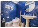 Unique powder room featuring a modern sink and bright blue textured walls at 4040 Annecy Dr, Atlanta, GA 30331