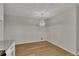 Eat-in kitchen dining area features a modern chandelier and hardwood floors at 4244 Newcomb Rd, Decatur, GA 30034