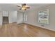 Spacious living area with hardwood floors, staircase, and multiple windows at 4244 Newcomb Rd, Decatur, GA 30034