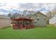 View of house from the backyard, featuring an inviting covered patio perfect for outdoor entertaining and relaxation at 618 Jenmarie Sw Dr, Mableton, GA 30126
