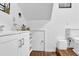 Bright bathroom featuring a modern vanity, toilet, and unique storage space at 618 Jenmarie Sw Dr, Mableton, GA 30126