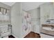 Nautical-themed bathroom with decorative shower curtain and neutral wall decor at 618 Jenmarie Sw Dr, Mableton, GA 30126
