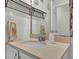 Functional bathroom featuring a vanity with ample countertop space and decorative shelves at 618 Jenmarie Sw Dr, Mableton, GA 30126