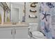 Functional bathroom featuring a vanity with ample countertop space and decorative shelves at 618 Jenmarie Sw Dr, Mableton, GA 30126