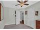 Bedroom featuring neutral paint, carpeted floor, ceiling fan, and natural light streaming in through the window at 618 Jenmarie Sw Dr, Mableton, GA 30126
