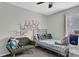 Bright bedroom featuring a stylish bed, accent chair, and ample natural light at 618 Jenmarie Sw Dr, Mableton, GA 30126