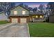 Charming two-story home with a well-maintained lawn, a two-car garage, and inviting front porch at 618 Jenmarie Sw Dr, Mableton, GA 30126