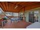 Cozy covered patio with dining area, a hammock and easy access to both the yard and the interior at 618 Jenmarie Sw Dr, Mableton, GA 30126