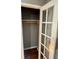 Bedroom closet featuring built-in shelving and hardwood floors at 1212 Utoy Springs Sw Rd # 44, Atlanta, GA 30331