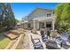 Backyard featuring covered patio, fire pit and mature trees at 2742 Oak Village Trl, Decatur, GA 30032