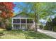 Charming two-story home with a welcoming front porch and beautifully landscaped front yard in a suburban setting at 2742 Oak Village Trl, Decatur, GA 30032