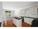 Bright, modern kitchen with stainless steel appliances, an island, and hardwood floors and attached breakfast nook at 2742 Oak Village Trl, Decatur, GA 30032