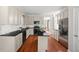Well-lit kitchen featuring stainless steel appliances, granite countertops, and white cabinetry at 2742 Oak Village Trl, Decatur, GA 30032