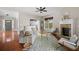 Comfortable living room featuring a stone fireplace, hardwood floors, and stylish decor at 2742 Oak Village Trl, Decatur, GA 30032