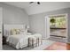 Bright main bedroom offering a balcony view and hardwood floors at 2742 Oak Village Trl, Decatur, GA 30032