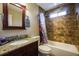 Bathroom features a vanity sink, toilet, and tub-shower combination at 4558 Bronte Ln, Douglasville, GA 30135
