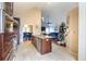Open-concept kitchen with stainless appliances, island, and a view into the living and dining areas at 4558 Bronte Ln, Douglasville, GA 30135