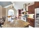 Bright eat-in kitchen with stainless steel appliances, granite countertops, and a central island at 4558 Bronte Ln, Douglasville, GA 30135