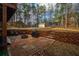Brick patio features an outdoor grill, seating, and steps to a raised backyard at 4558 Bronte Ln, Douglasville, GA 30135