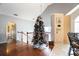 Second floor hallway with hardwood floors, decorative Christmas tree, and a view of the room below at 4558 Bronte Ln, Douglasville, GA 30135