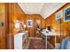 Attic room with wood paneling converted to an office featuring desk, shelving, and a cozy area at 595 Ridgecrest Ne Rd, Atlanta, GA 30307