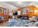 Attic room with wood paneling, built-in shelving, and a cozy seating area filled with light from a window at 595 Ridgecrest Ne Rd, Atlanta, GA 30307