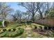Serene backyard with a stone path, lush greenery, and mature trees, a peaceful space for outdoor relaxation at 595 Ridgecrest Ne Rd, Atlanta, GA 30307