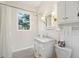 Classic white bathroom with subway tile and marble vanity at 595 Ridgecrest Ne Rd, Atlanta, GA 30307