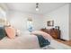 Bedroom with an airy aesthetic featuring a soft color palette, hardwood floors, and bright natural light at 595 Ridgecrest Ne Rd, Atlanta, GA 30307