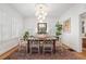 Elegant dining room with ample windows, a modern chandelier, and stylish decor accents at 595 Ridgecrest Ne Rd, Atlanta, GA 30307