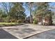 Spacious driveway leading to the back of a brick home, providing ample parking and backyard access at 595 Ridgecrest Ne Rd, Atlanta, GA 30307