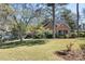 Well-maintained front yard with mature trees and manicured lawn, enhancing the curb appeal of this charming home at 595 Ridgecrest Ne Rd, Atlanta, GA 30307