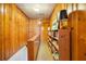 Upstairs hallway featuring wood paneling, built-in bookshelves, and a warm, inviting atmosphere at 595 Ridgecrest Ne Rd, Atlanta, GA 30307