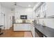 Charming kitchen with white cabinetry, black countertops, and stainless steel appliances at 595 Ridgecrest Ne Rd, Atlanta, GA 30307