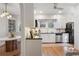 Bright kitchen with stainless steel appliances, hardwood floors, and open access to dining area at 595 Ridgecrest Ne Rd, Atlanta, GA 30307