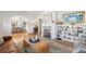 Bright living room showcasing built-in bookshelves, fireplace, and a view into the adjacent dining room at 595 Ridgecrest Ne Rd, Atlanta, GA 30307
