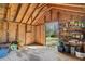 Interior view of shed with shelving and outdoor tools. Open door looks out to backyard at 595 Ridgecrest Ne Rd, Atlanta, GA 30307