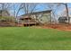 Expansive backyard showcasing the home's exterior, dual decks, and lush green lawn, perfect for outdoor enjoyment at 2401 Westland Way, Acworth, GA 30102