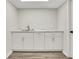 Finished basement with a long countertop, sink and ample cabinet storage at 2401 Westland Way, Acworth, GA 30102