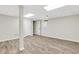 Finished basement with wood-look floors and multiple entry doors at 2401 Westland Way, Acworth, GA 30102