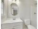 This bathroom features an oval mirror, large sink, and walk-in shower at 2401 Westland Way, Acworth, GA 30102